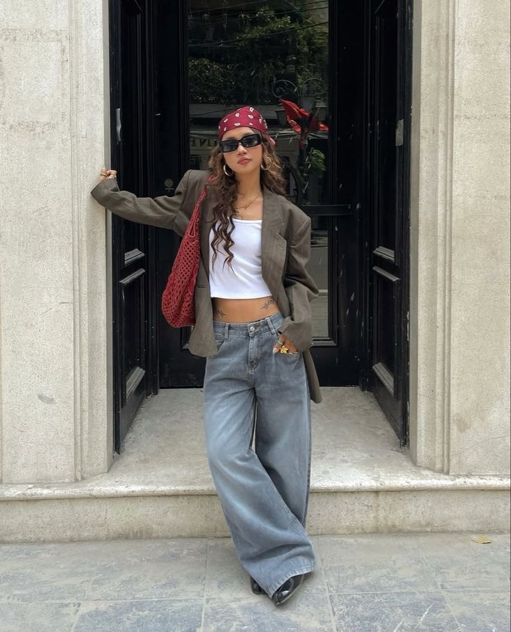 Oversized brown blazer with white crop top and grey wide leg jeans